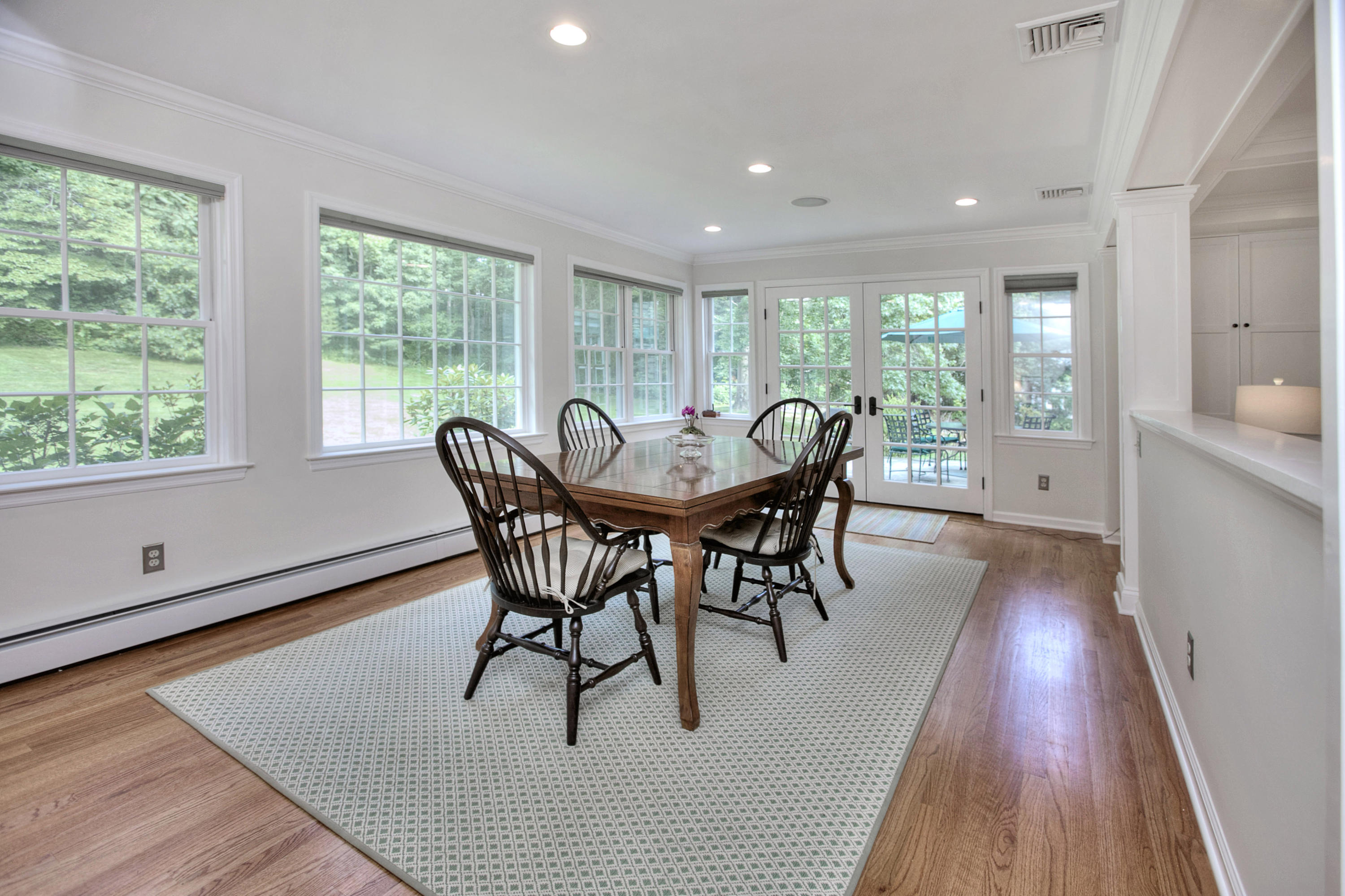 390 Middlesex Road Darien, CT 06820 - Photo 8 of 24 a view of a dining room with furniture window and wooden floor