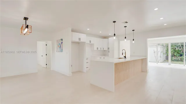a view of kitchen with wooden floor