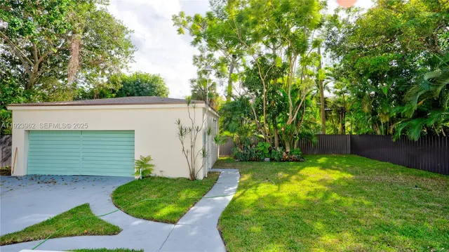 a view of a backyard with a small cabin