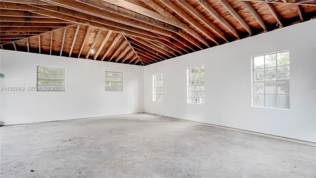 a bathroom with a toilet sink vanity and mirror