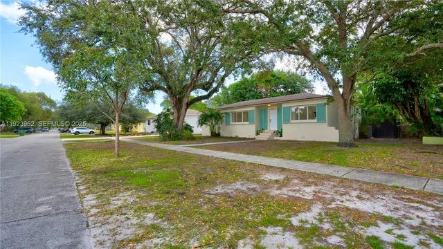 an aerial view of a house with outdoor space and street view