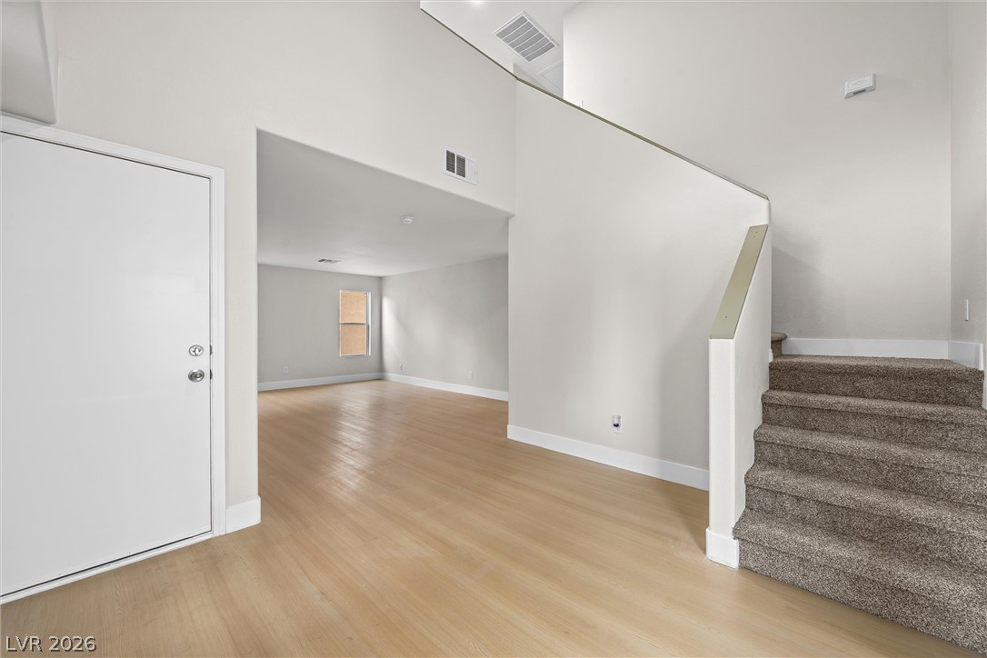 2650 Whisper Ridge Street Las Vegas, NV 89156 - Photo 7 of 28 Smooth wood floors flow throughout this inviting entry hall with soaring ceilings.
