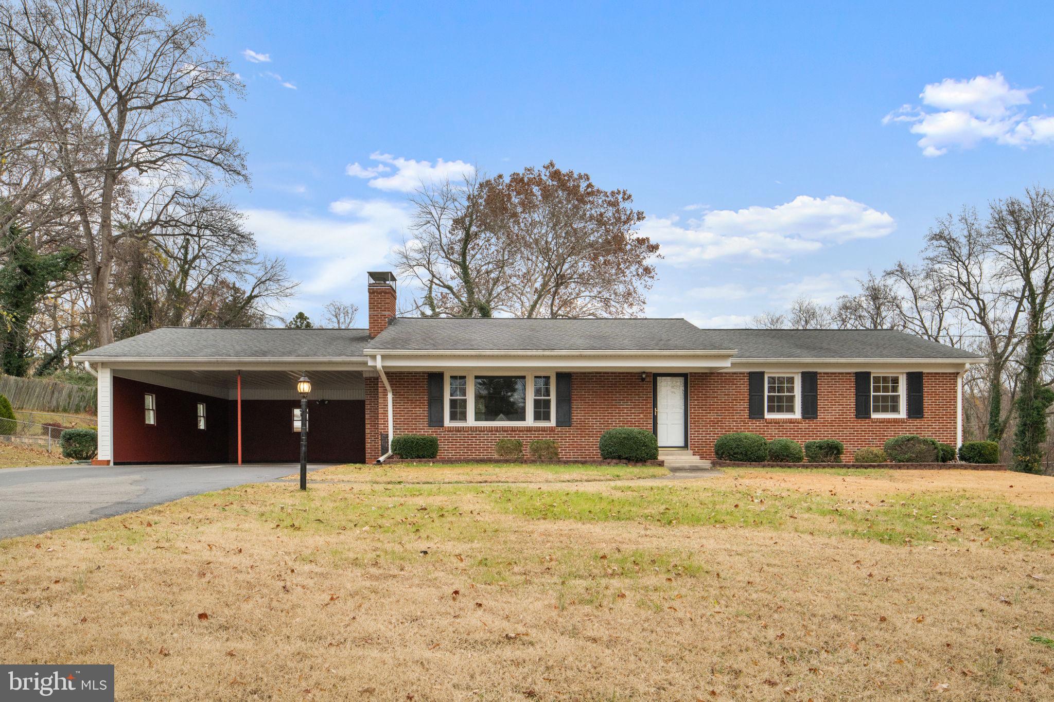 19227 Cardinal Heights Road Triangle, VA 22172 - Photo 1 of 64 front view of a house with a yard
