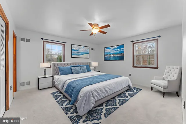 a front view of house with yard and trees