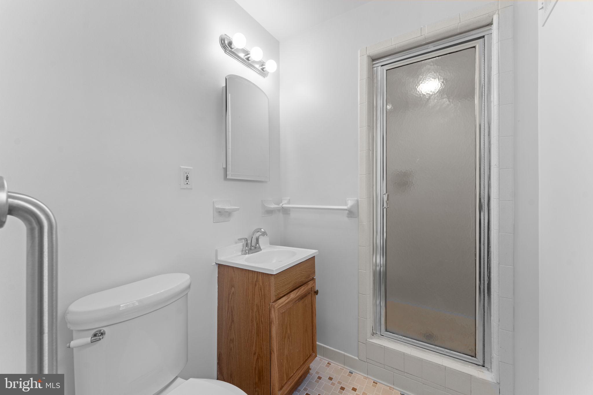 19227 Cardinal Heights Road Triangle, VA 22172 - Photo 24 of 64 a bathroom with a toilet sink and shower
