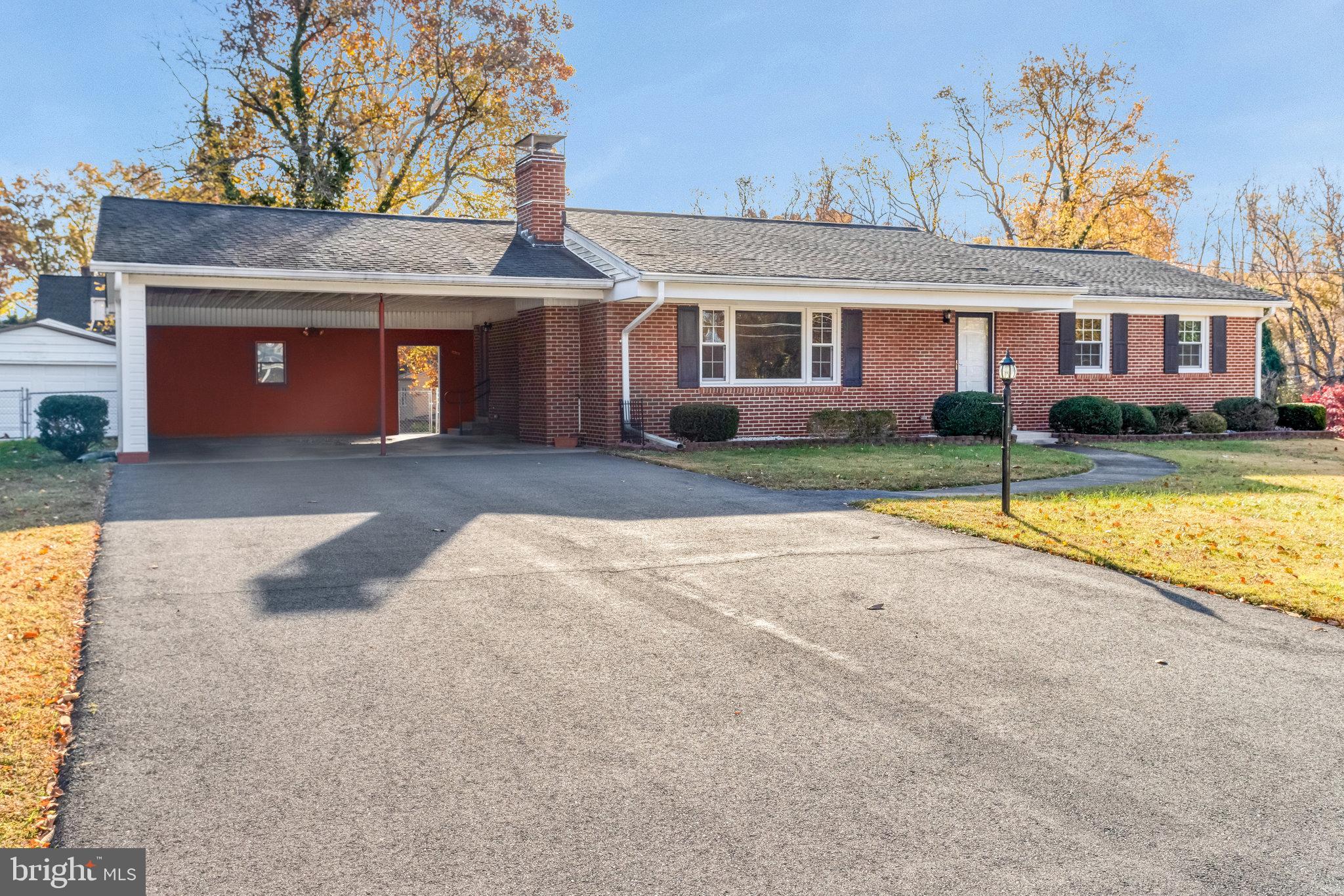 19227 Cardinal Heights Road Triangle, VA 22172 - Photo 56 of 64 a view of a house with a yard and a large tree