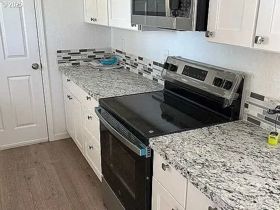 a kitchen with a stove and a sink
