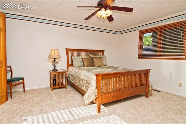 1129 Cresta Road Colorado Springs, CO 80905 - Photo 19 of 35 2nd bedroom on the upper level. Bathroom attached.