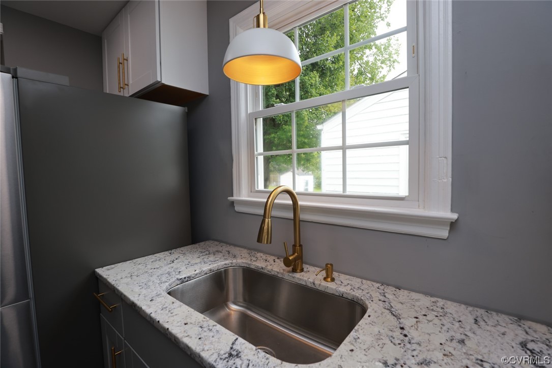 524 Chestnut Avenue Colonial Heights, VA 23834 - Photo 17 of 44 a kitchen with a sink a window and cabinets