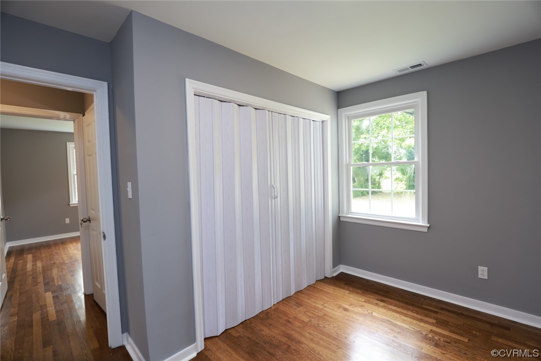 524 Chestnut Avenue Colonial Heights, VA 23834 - Photo 19 of 44 a view of an empty room with wooden floor and a window