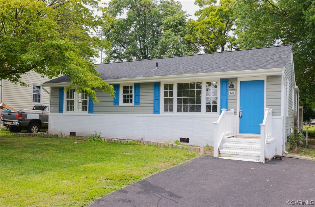 524 Chestnut Avenue Colonial Heights, VA 23834 - Photo 2 of 44 a front view of a house with a garden and yard