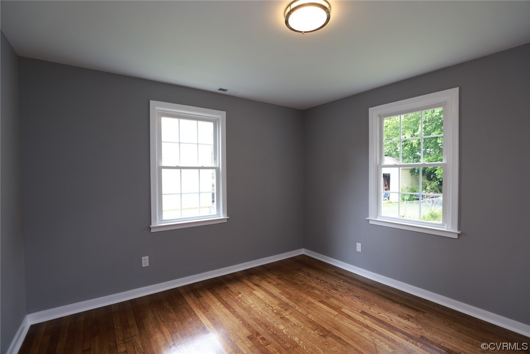 524 Chestnut Avenue Colonial Heights, VA 23834 - Photo 24 of 44 a view of empty room with wooden floor and fan
