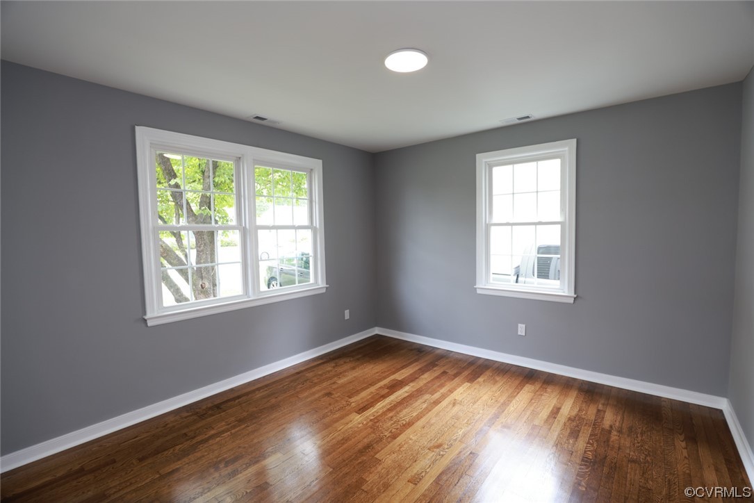 524 Chestnut Avenue Colonial Heights, VA 23834 - Photo 30 of 44 a view of an empty room with wooden floor and a window