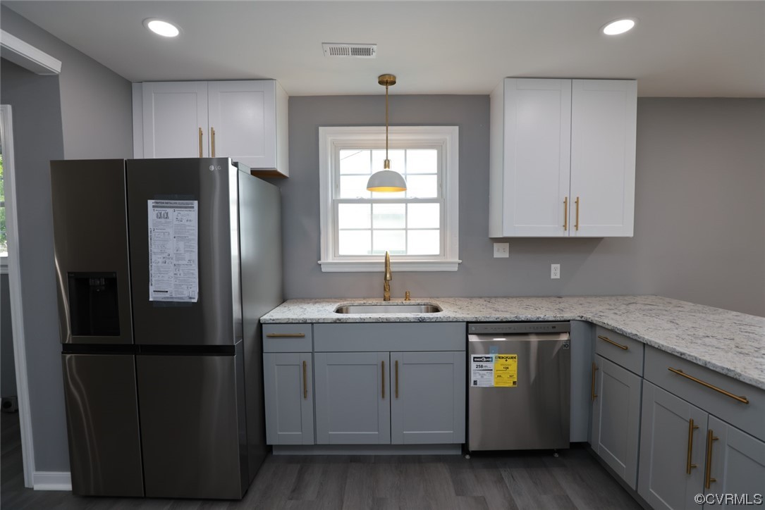 524 Chestnut Avenue Colonial Heights, VA 23834 - Photo 32 of 44 a kitchen with a refrigerator sink and cabinets