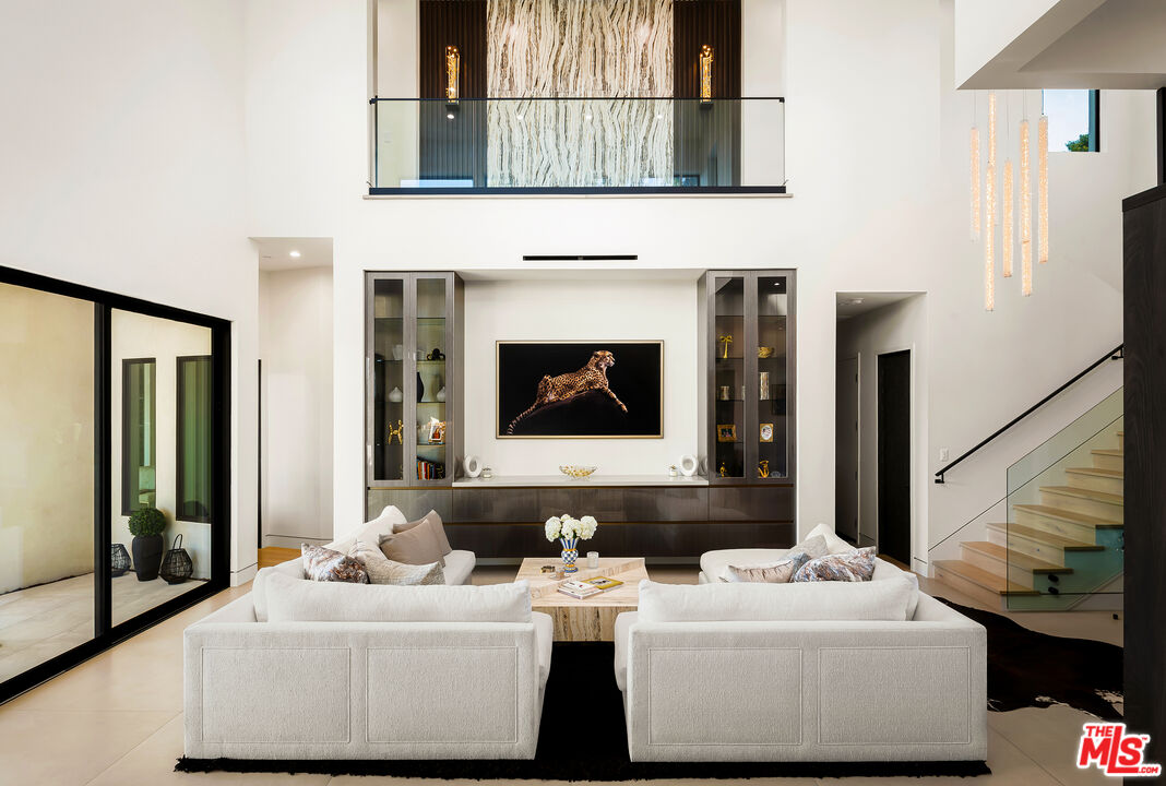 1367 Casiano Road Los Angeles, CA 90049 - Photo 7 of 26 a living room with furniture and a fireplace