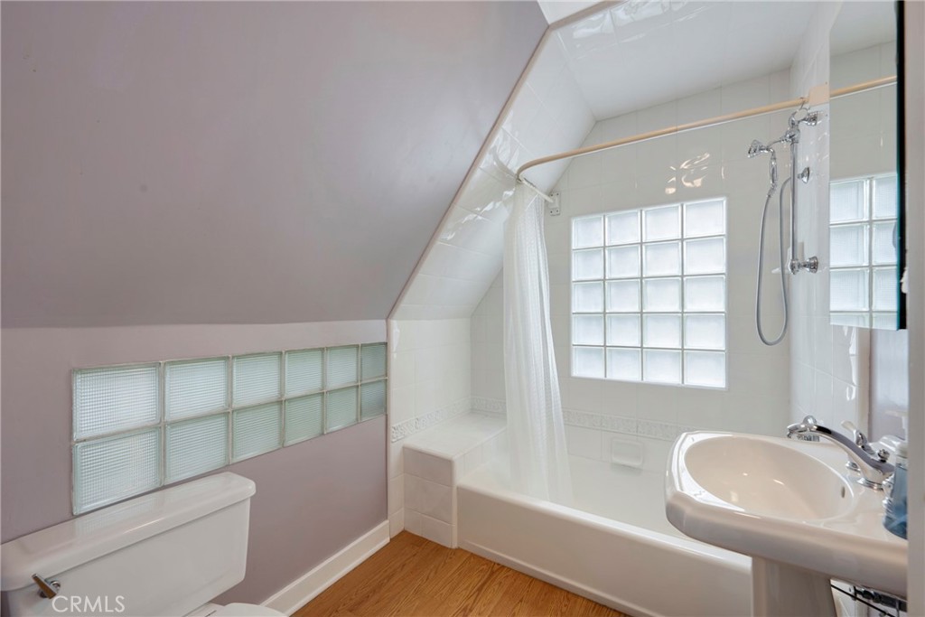1146 North Puente Street Brea, CA 92821 - Photo 14 of 36 a bathroom with a sink a toilet and shower