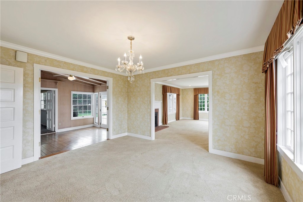 1146 North Puente Street Brea, CA 92821 - Photo 19 of 36 a view of a big room with chandelier and windows