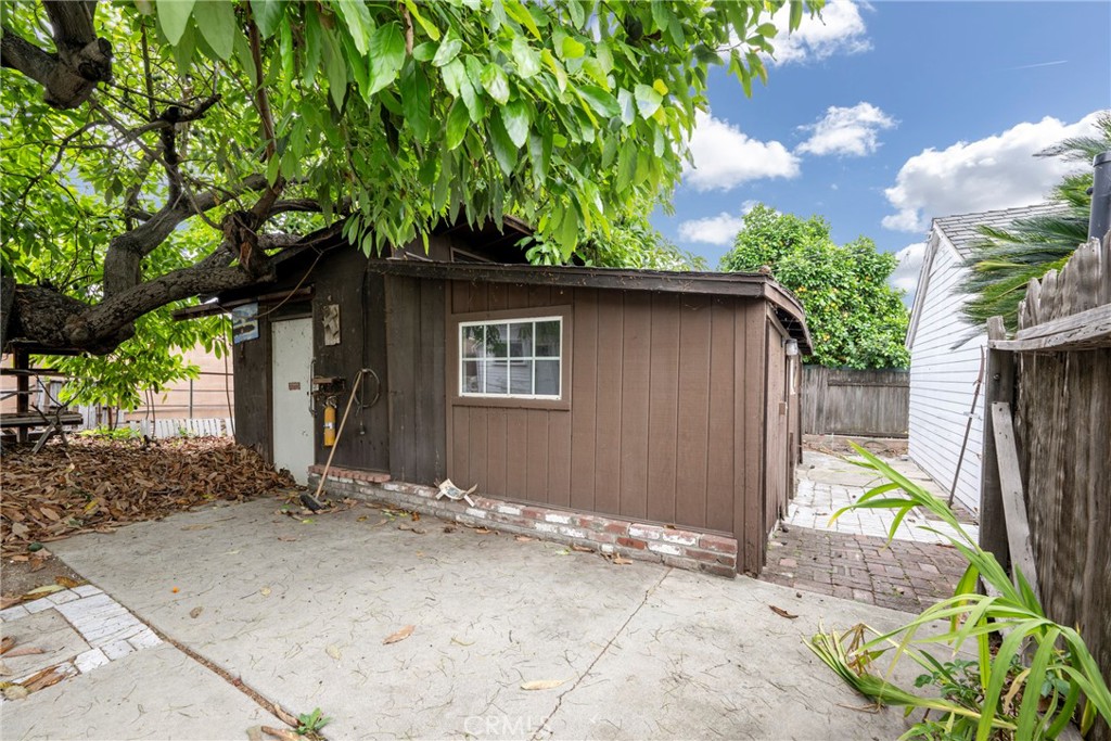 1146 North Puente Street Brea, CA 92821 - Photo 23 of 36 a backyard of a house with plants and outdoor seating