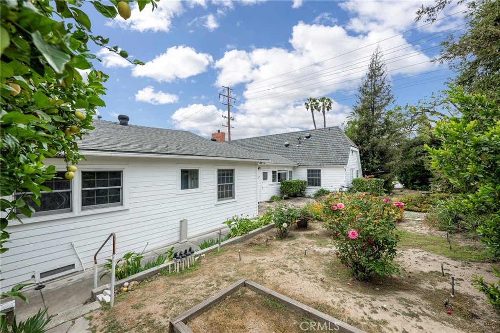 1146 North Puente Street Brea, CA 92821 - Photo 28 of 36 a front view of a house with garden