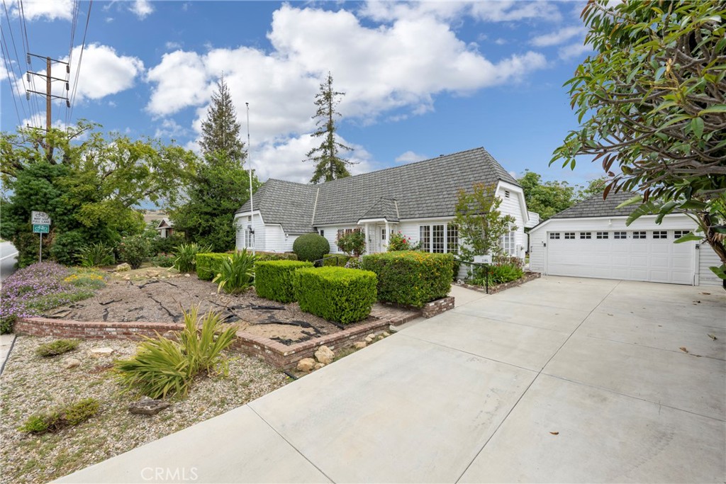 1146 North Puente Street Brea, CA 92821 - Photo 31 of 36 a front view of a house with garden