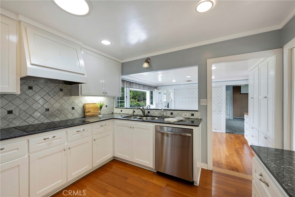 1146 North Puente Street Brea, CA 92821 - Photo 5 of 36 a kitchen with sink stove and cabinets
