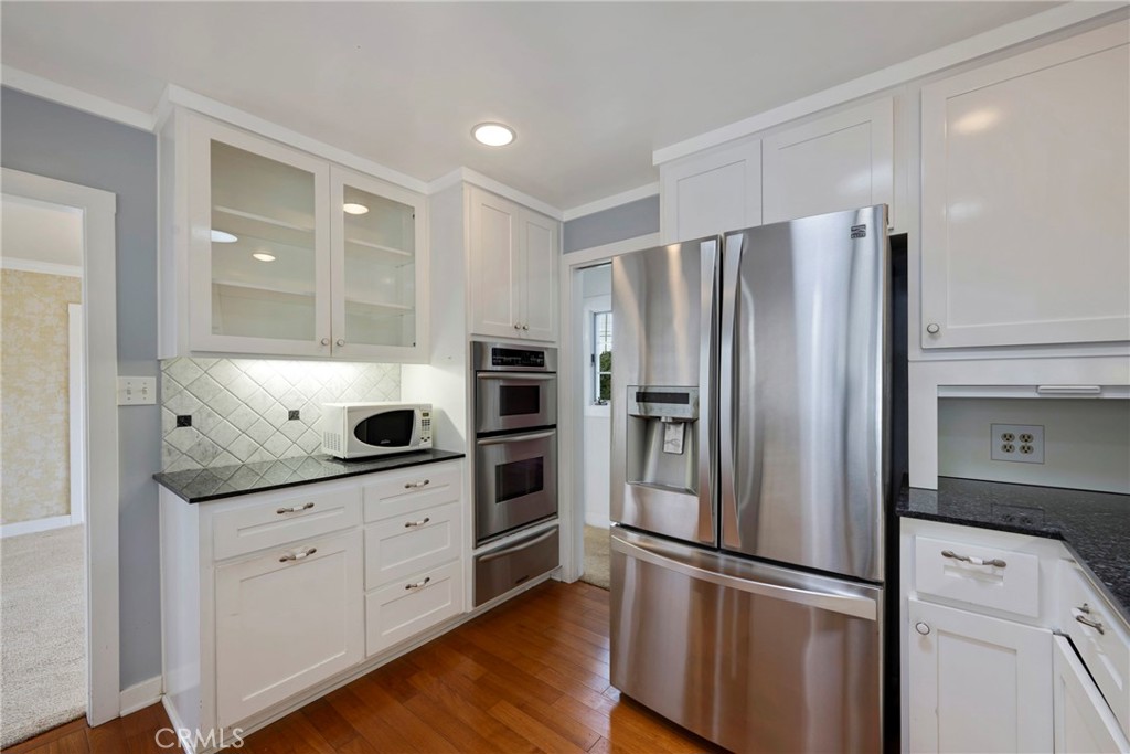 1146 North Puente Street Brea, CA 92821 - Photo 6 of 36 a kitchen with stainless steel appliances a refrigerator sink and stove