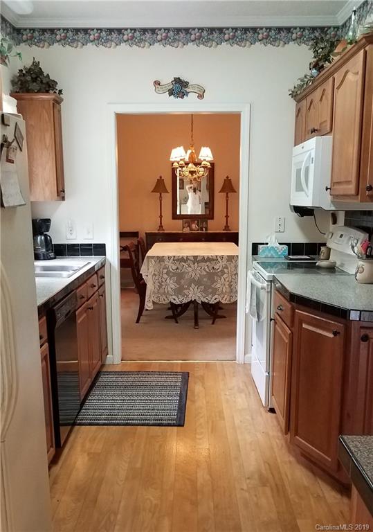 732 Lookout Tower Road Blacksburg, SC 29702 - Photo 14 of 31 a kitchen with a stove a sink and a refrigerator