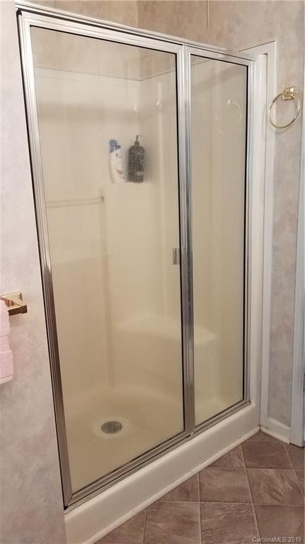732 Lookout Tower Road Blacksburg, SC 29702 - Photo 22 of 31 a bathroom with a glass shower door