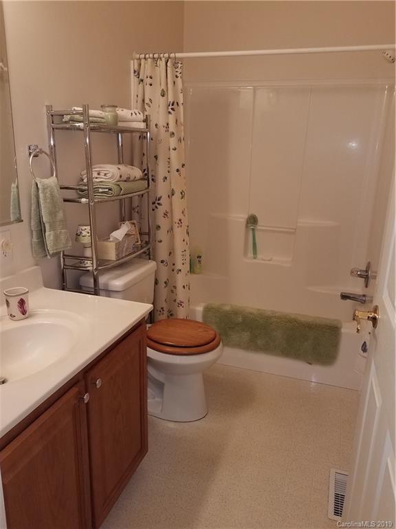 732 Lookout Tower Road Blacksburg, SC 29702 - Photo 23 of 31 a bathroom with a granite countertop sink a toilet and shower