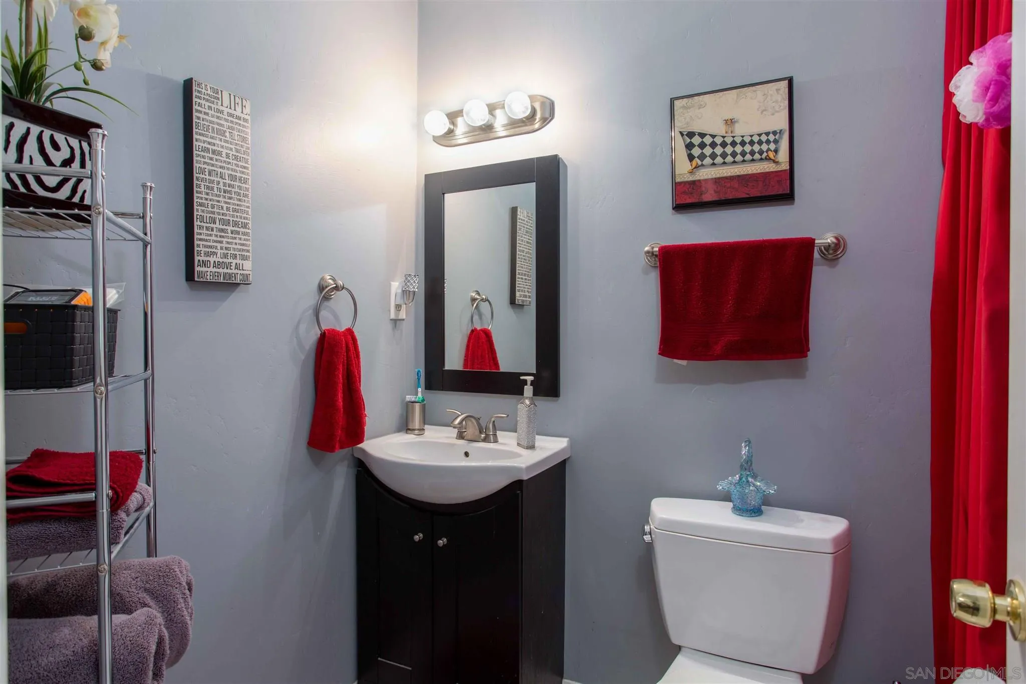 10384 Alphonse Street, Unit E6 Santee, CA 92071 - Photo 12 of 26 a bathroom with a sink and a mirror