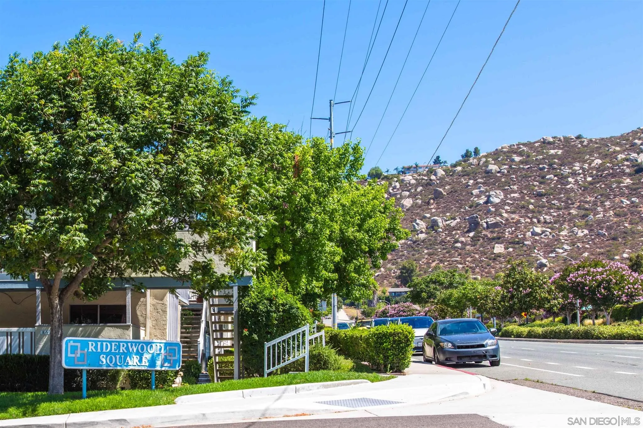 10384 Alphonse Street, Unit E6 Santee, CA 92071 - Photo 19 of 26 a front view of a house with garden