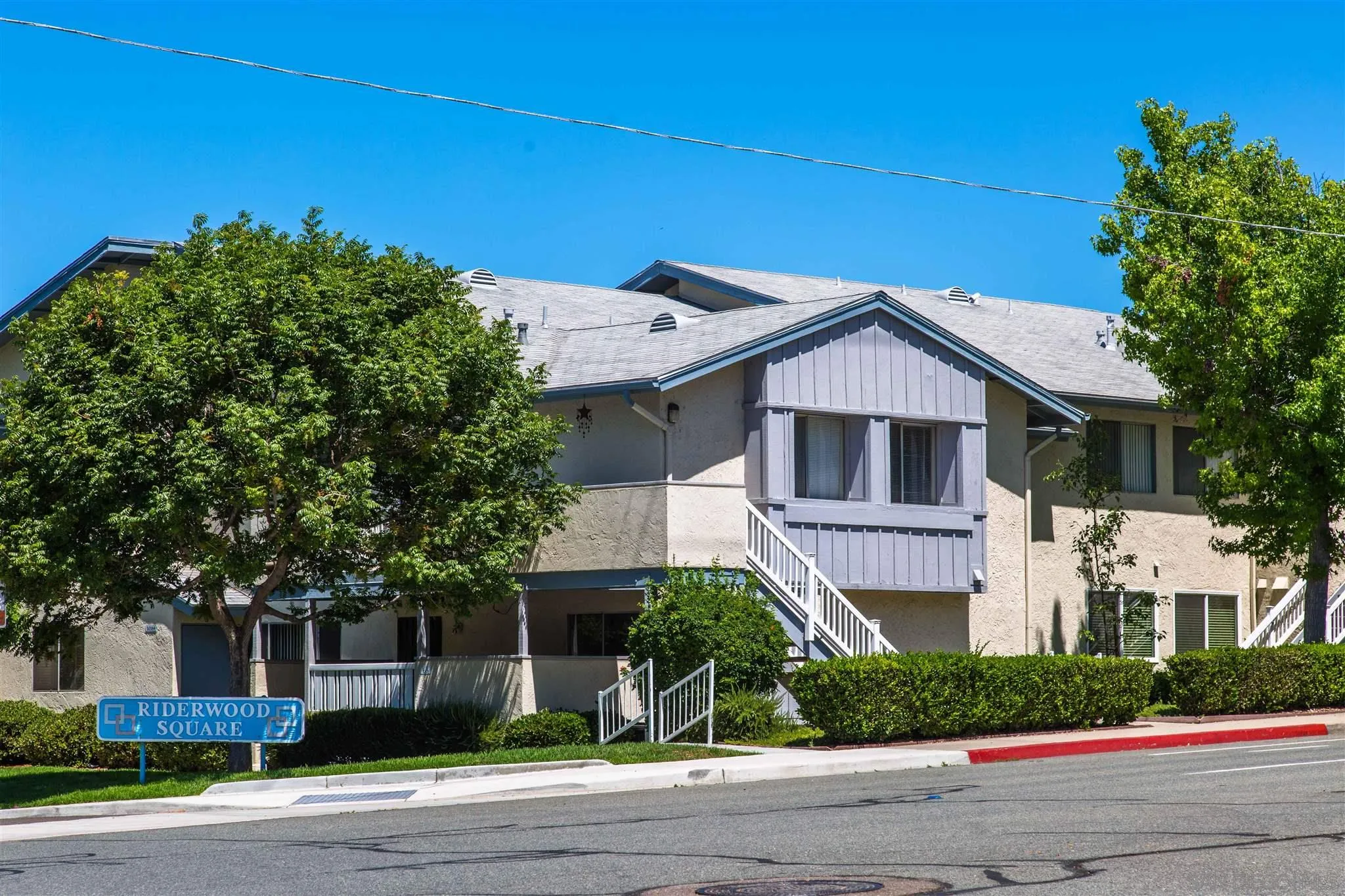 10384 Alphonse Street, Unit E6 Santee, CA 92071 - Photo 25 of 26 a front view of a house with a yard