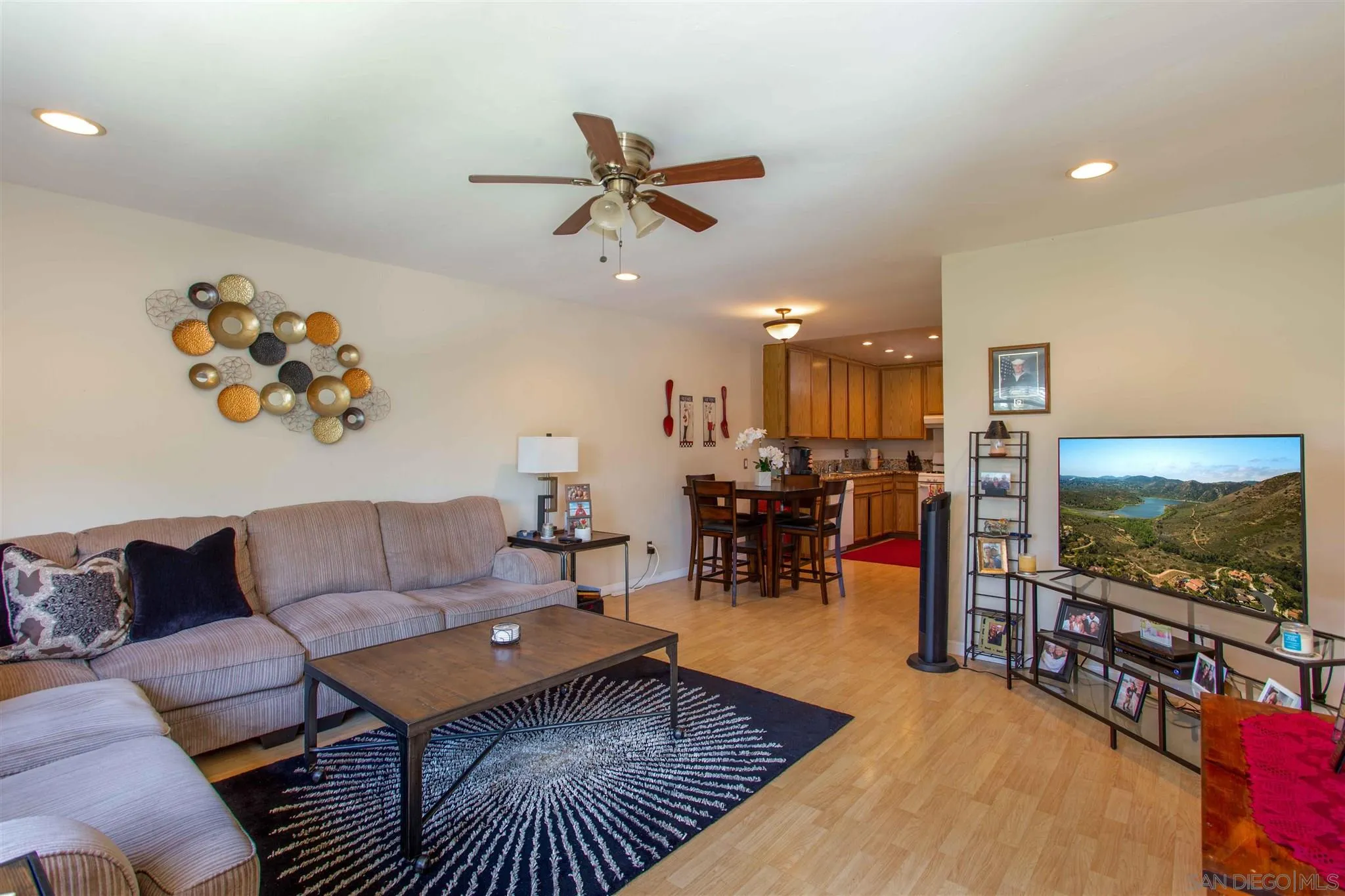 10384 Alphonse Street, Unit E6 Santee, CA 92071 - Photo 4 of 26 a living room with furniture and a flat screen tv