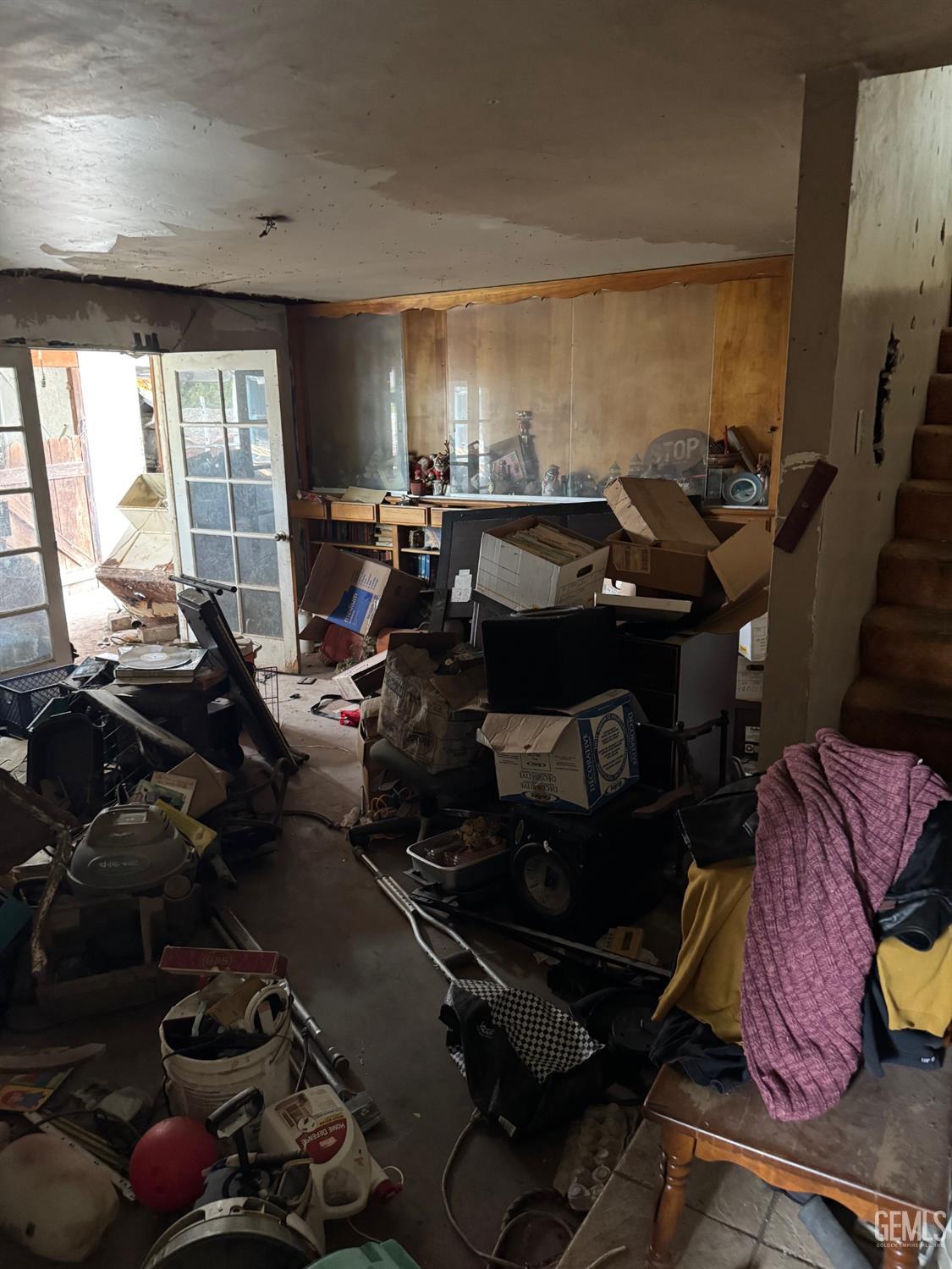 Undisclosed Address Bakersfield, CA 93307 - Photo 4 of 10 a room with gym equipment and a large window