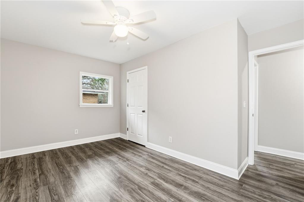 4319 Tradition Terrace Austell, GA 30106 - Photo 17 of 46 an empty room with wooden floor and windows