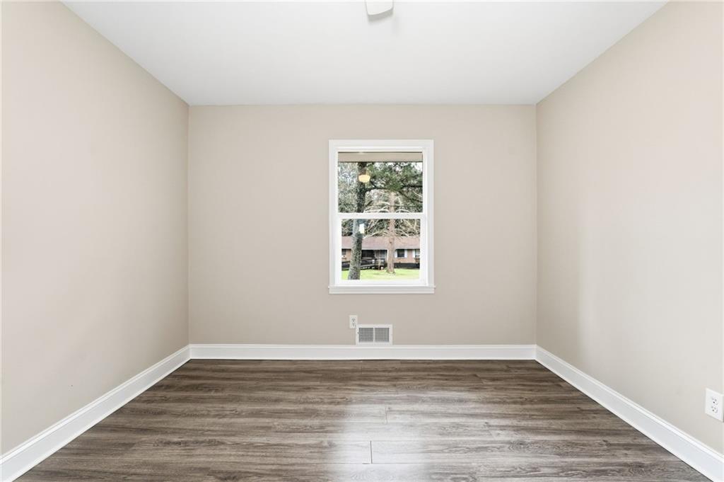 4319 Tradition Terrace Austell, GA 30106 - Photo 25 of 46 wooden floor in an empty room with a window