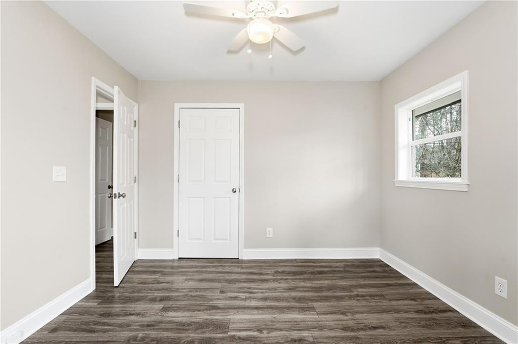 4319 Tradition Terrace Austell, GA 30106 - Photo 26 of 46 a view of an empty room with wooden floor and a window