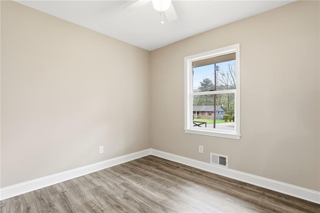 4319 Tradition Terrace Austell, GA 30106 - Photo 28 of 46 an empty room with wooden floor and windows