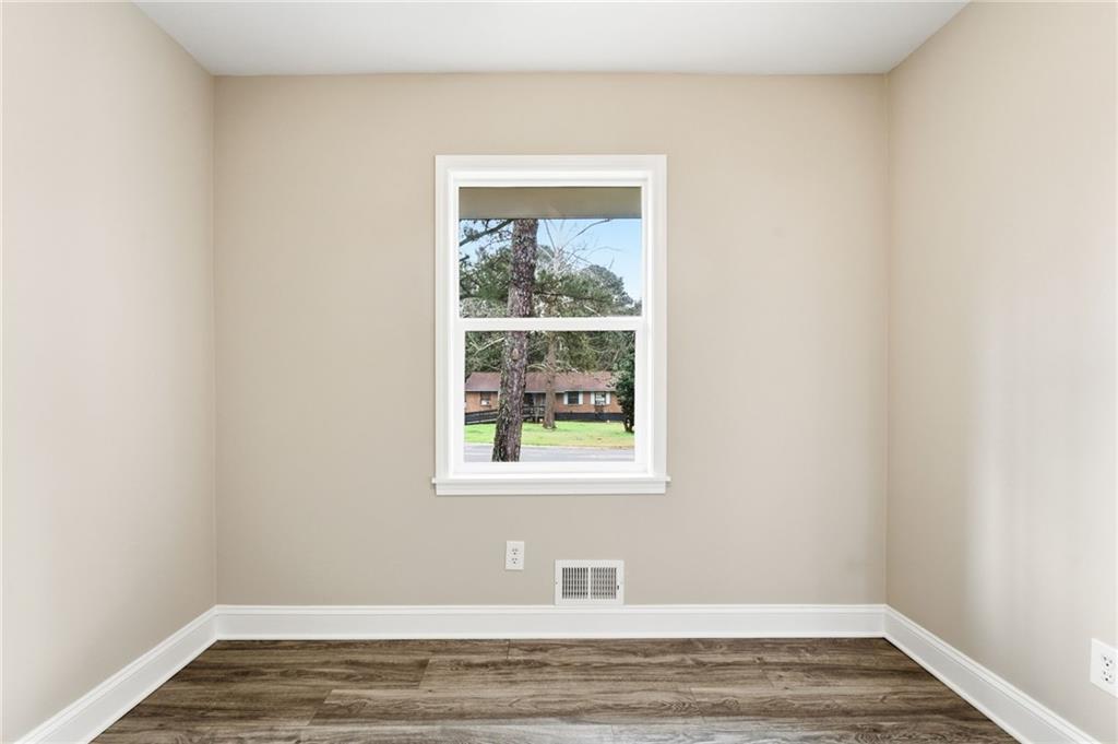 4319 Tradition Terrace Austell, GA 30106 - Photo 29 of 46 a view of an empty room with wooden floor and a window