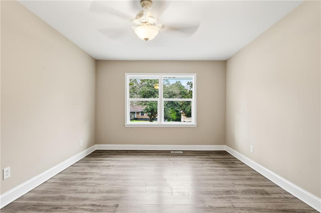 4319 Tradition Terrace Austell, GA 30106 - Photo 30 of 46 an empty room with wooden floor and windows