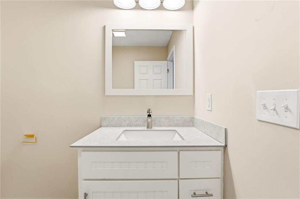 4319 Tradition Terrace Austell, GA 30106 - Photo 32 of 46 a bathroom with a sink and a mirror