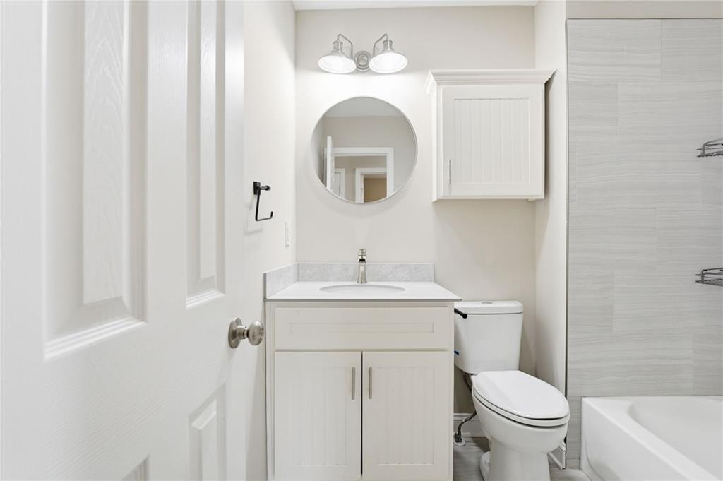 4319 Tradition Terrace Austell, GA 30106 - Photo 34 of 46 a bathroom with a toilet sink and mirror