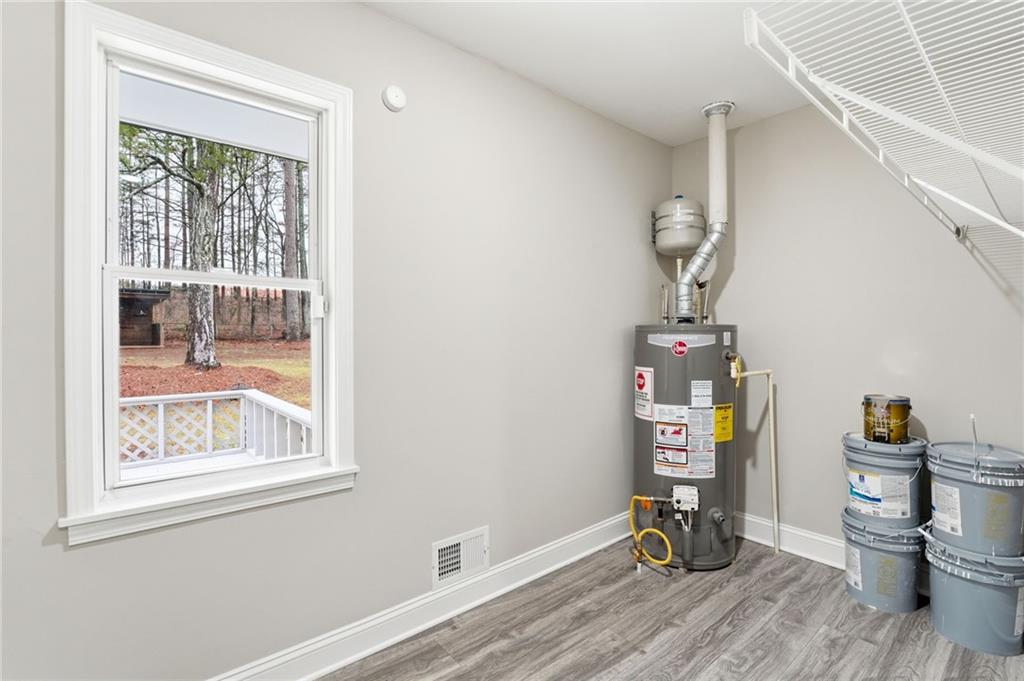 4319 Tradition Terrace Austell, GA 30106 - Photo 35 of 46 a view of a hallway with wooden floor and a window