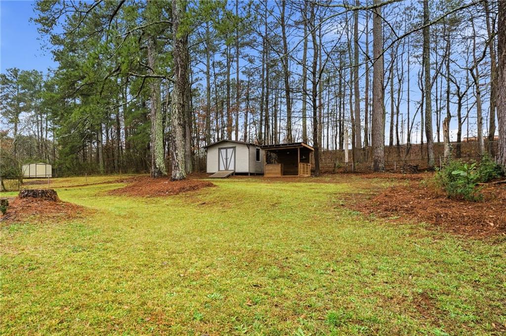 4319 Tradition Terrace Austell, GA 30106 - Photo 38 of 46 a view of swimming pool with lawn chairs and wooden fence