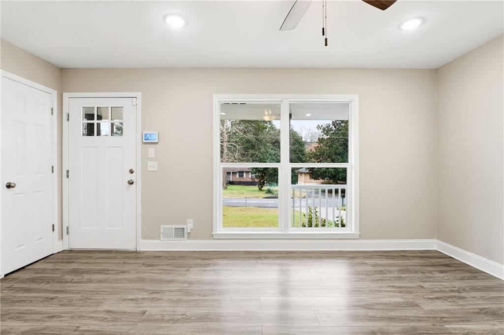 4319 Tradition Terrace Austell, GA 30106 - Photo 6 of 46 a view of an empty room with wooden floor and a window