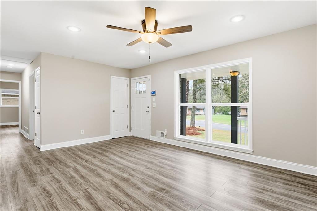 4319 Tradition Terrace Austell, GA 30106 - Photo 10 of 46 an empty room with wooden floor and windows