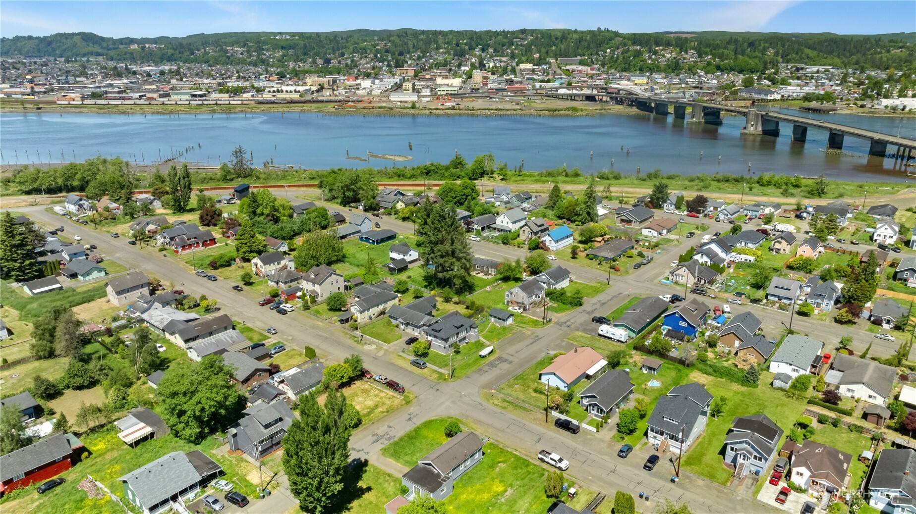 1105 West Perry Street Aberdeen, WA 98520 - Photo 5 of 20 an aerial view of residential houses with outdoor space and river