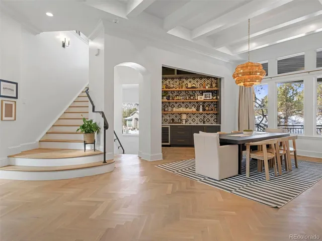 a view of a livingroom with furniture and staircase