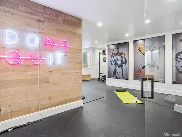 a room with a baby crib and a dresser