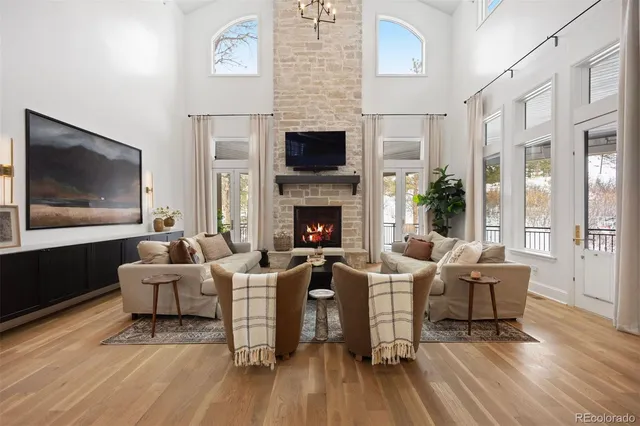 a living room with fireplace furniture and a flat screen tv